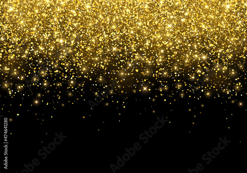 Holiday gold sparkling glitter scattered on black background. Vector