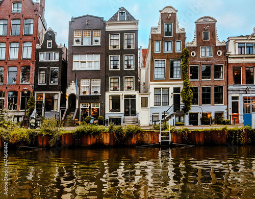 Amsterdam cute city with channels, bridges, old buildings, European architecture, Holland 