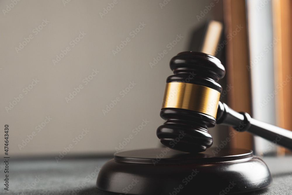 Law theme, judge gavel on a dark table with a book. Law theme, judge gavel on a dark table with a book.