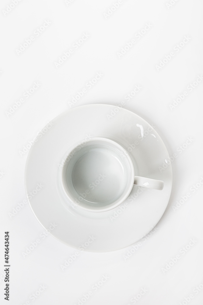White porcelain cup and saucer for cappuccino and coffee isolated on a white background White porcelain cup and saucer for cappuccino and coffee isolated on a white background