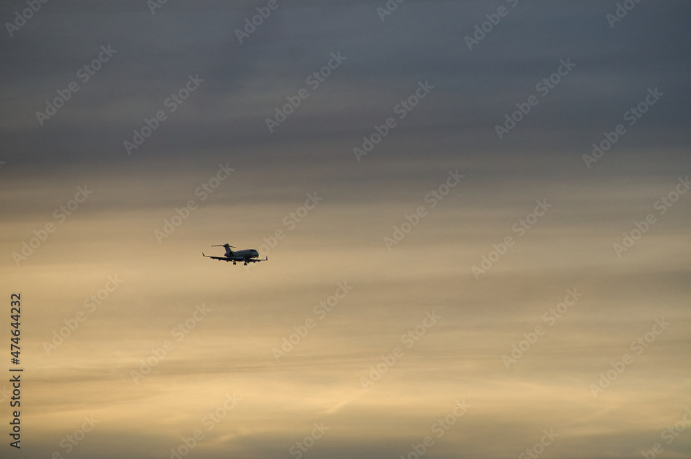 airplane in the evening sky in luminous horizon. airplane in the evening sky in luminous horizon.