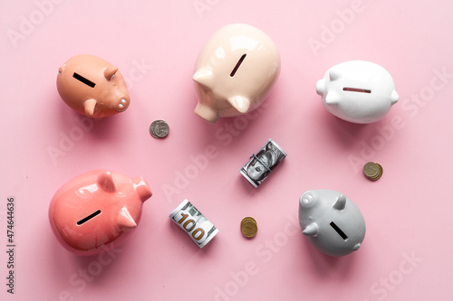 Piggy banks with coins. Currency saving and investments concept