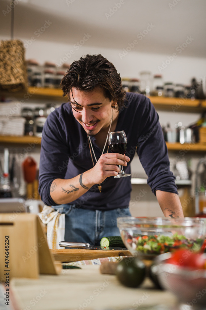 Fototapeta premium man preparing food in his kitchen