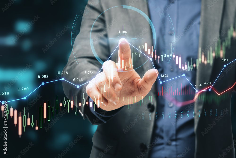 Close up of businessman hand pointing at glowing forex chart trading interface on blurry blue bokeh background. Market, economy and data exchange concept. Double exposure. Close up of businessman hand pointing at glowing forex chart trading interface on blurry blue bokeh background. Market, economy and data exchange concept. Double exposure.