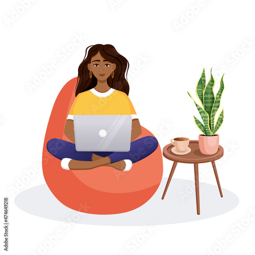 Woman sits on the bean bag chair and works at the computer. Remote work, office at home, programming, freelance. Study at home in quarantine. Vector illustration.