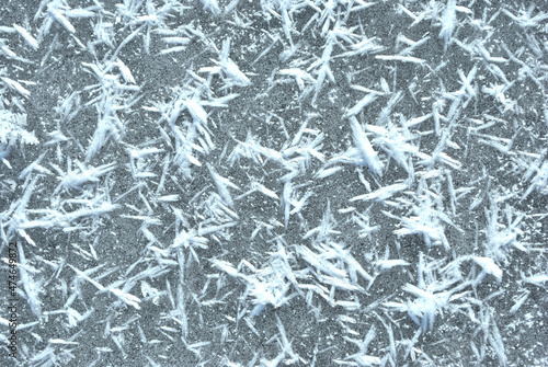 Ice surface with large fluffy snowflakes  natural organic background  top view