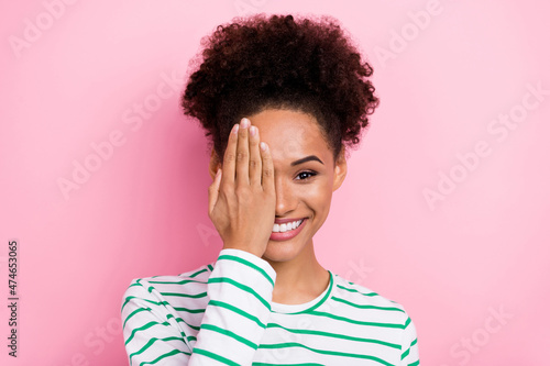 Photo of lovely bun hairstyle millennial lady close face wear white shirt isolated on pink color background