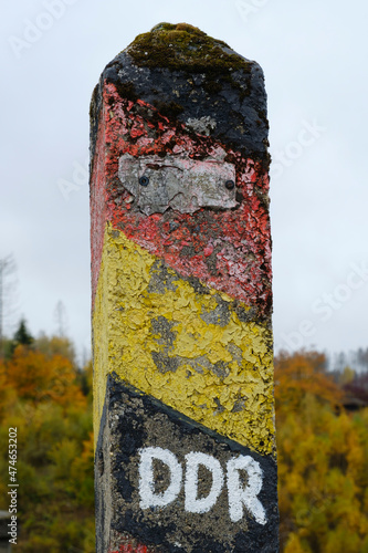 Old weathered stone border post photo