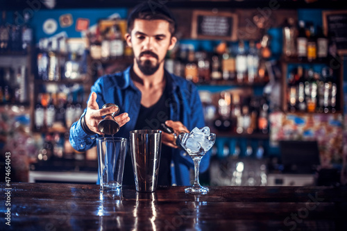 Barman makes a cocktail on the alehouse photo