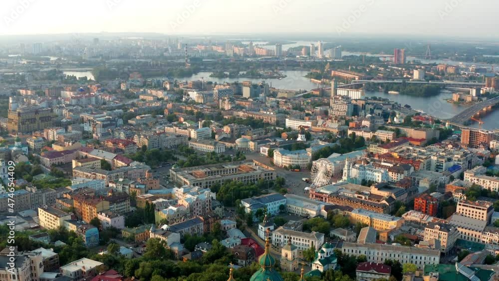 Top view of Podol. Many buildings and churches. Evening view of the river Dnipro. Top view of Podol. Many buildings and churches. Evening view of the river Dnipro.