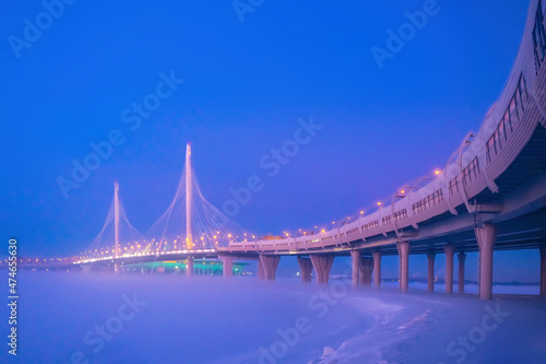 Saint Petersburg bridge. Russia highways. Expressway runs over bridge. Bridge of Gulf of Finland. Transport infrastructure of St. Petersburg. Overpass in winter fog. Expressway to winter Petersburg
