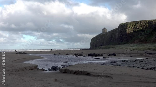 The sun is coming in at Downhill beach in County Londonderry in Northern Ireland photo