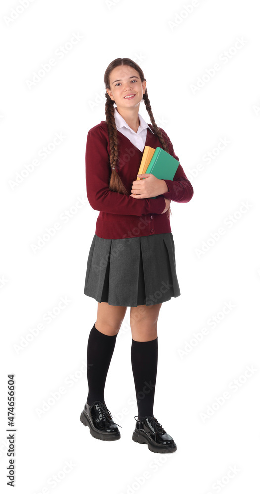 Teenage girl in school uniform with books on white background Teenage girl in school uniform with books on white background