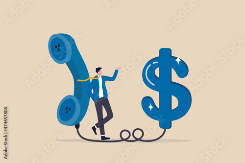 Telemarketing or telesales, phone call for selling product or business deal via telephone call, insurance agent concept, confidence salesman standing with telephone connected to money dollar sign. photo