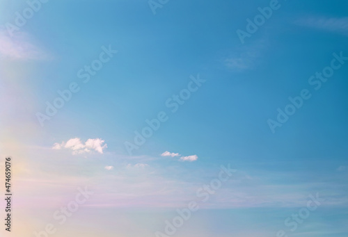 Sunset sky with fluffy light clouds soft focus. Heavenly clouds background. Concept of freedom, relaxation, ecology. Copy space. Empty space.