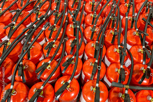 A lot of fire extinguishers. Protection and security in case of fire. Abstract background.