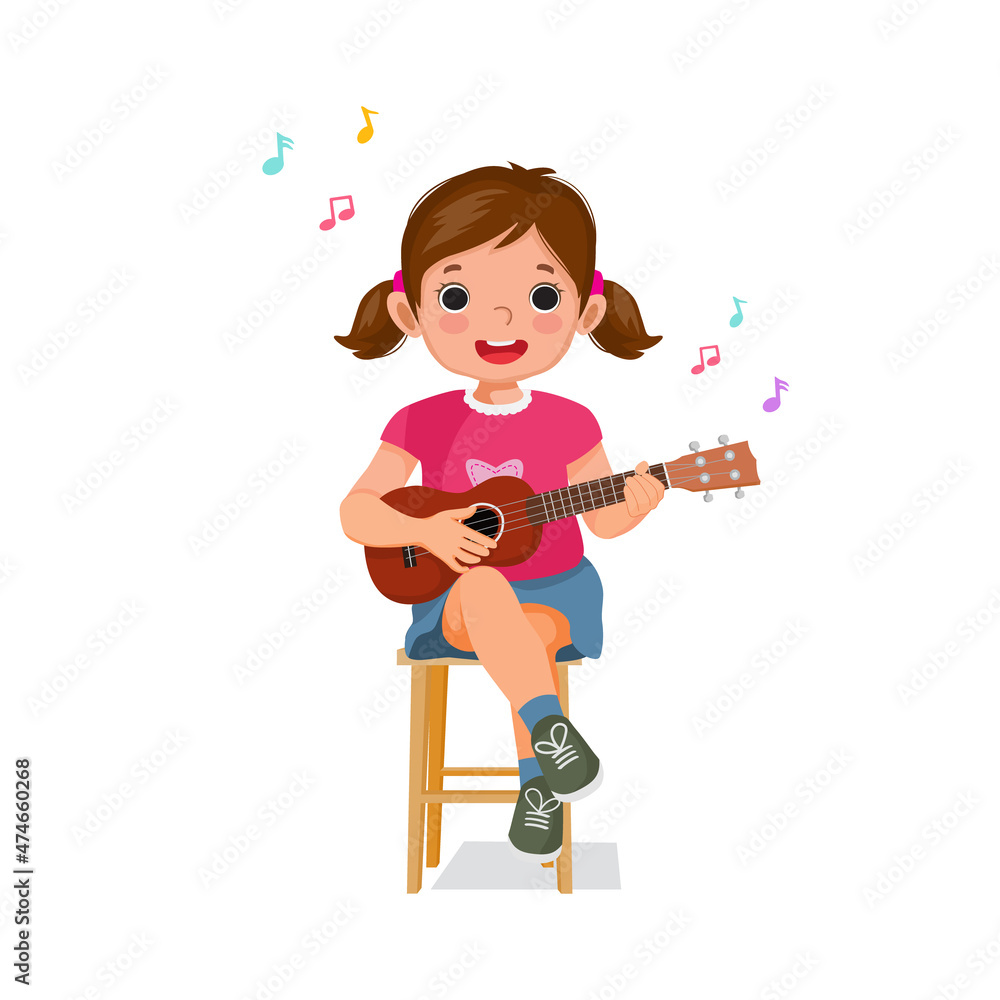 Cute little girl playing a ukulele or guitar sitting on a wooden chair singing Cute little girl playing a ukulele or guitar sitting on a wooden chair singing