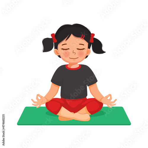 Little girl practicing yoga meditation sitting in lotus pose on mat at home