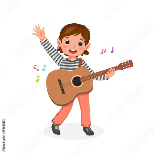 little girl playing guitar and singing waving hand with smiling facial expression