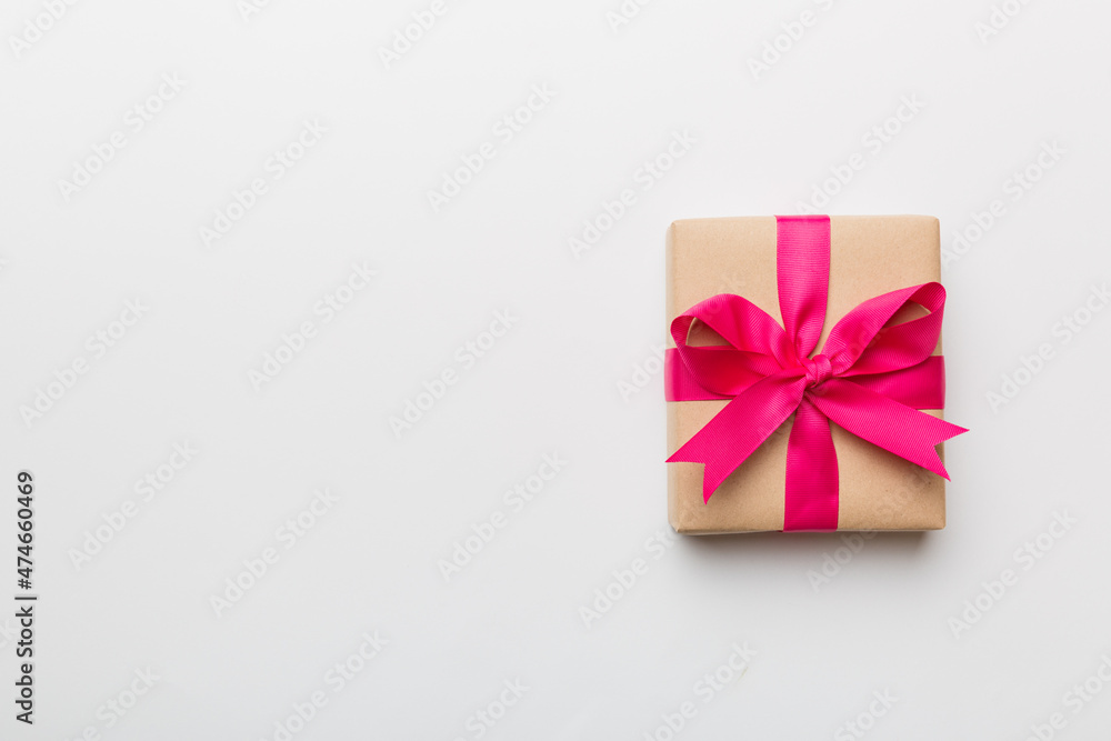 Holiday present box over colored background, top view. Copy space for design Holiday present box over colored background, top view. Copy space for design