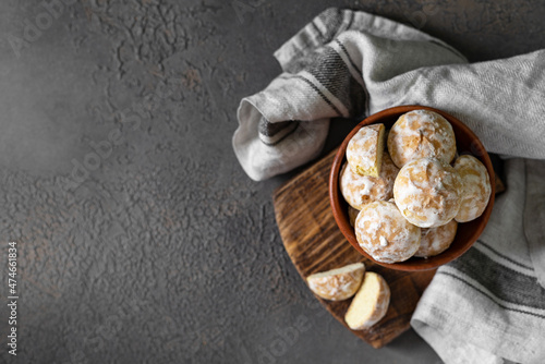 Lemon gingerbread in a wooden bowl on a dark culinary background. Delicious homemade cookies top view