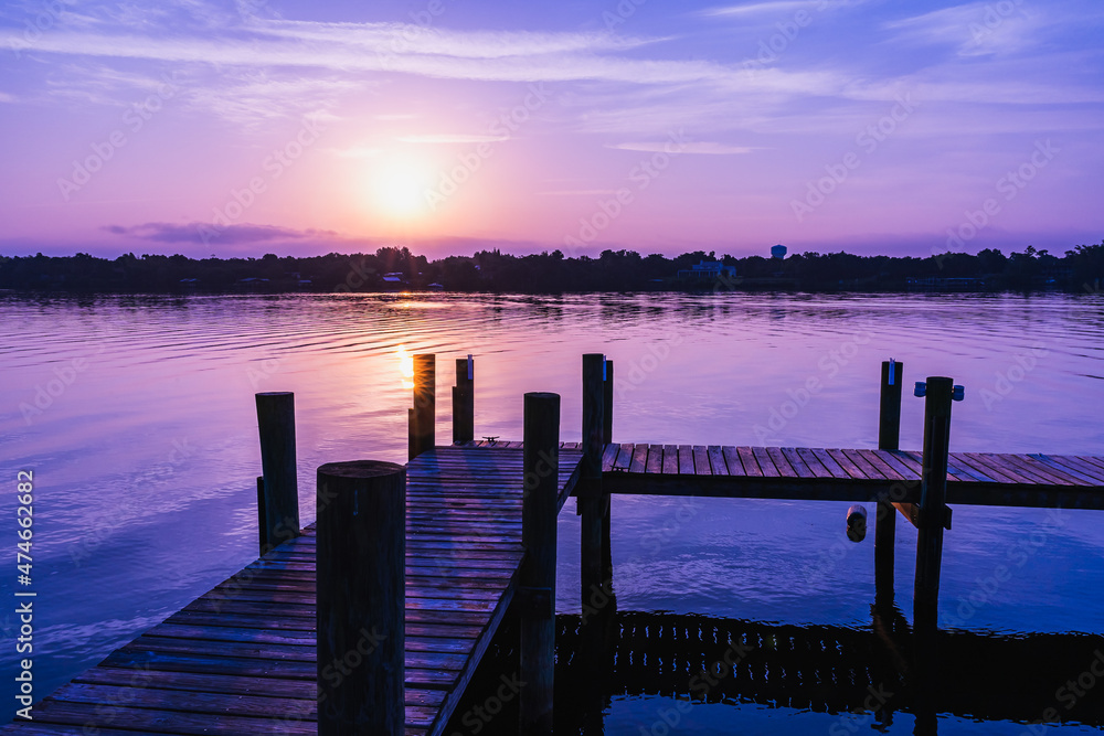 Fototapeta premium Sunrise over the Sebastian River at a private pier in Little Hollywood, Mikko, Florida