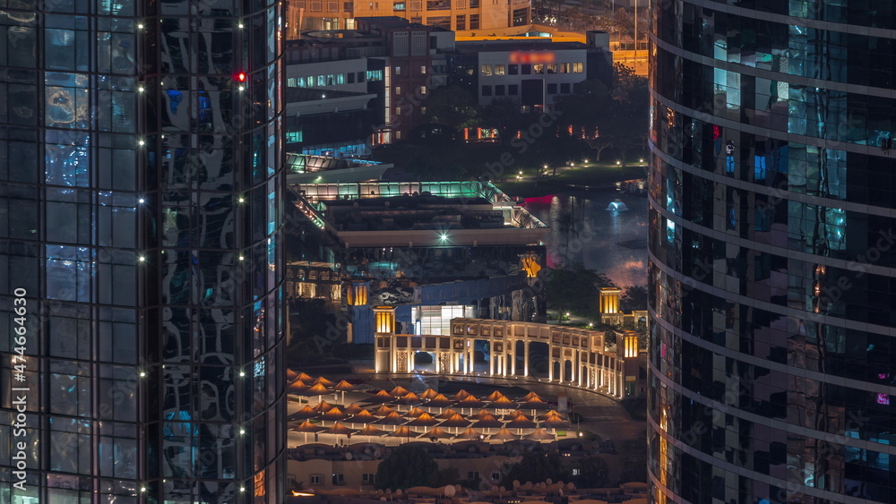 Aerial view of Dubai Internet City Lake and Buildings night timelapse