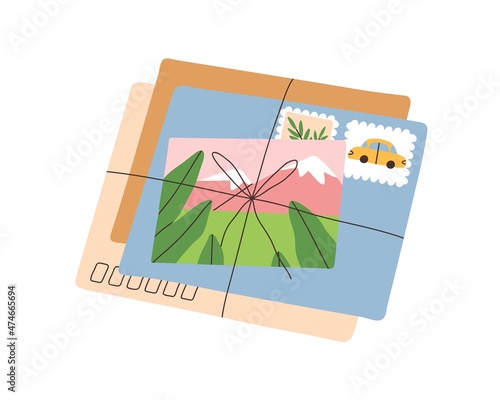 Envelopes stack with stamps and postcard from journey. Paper correspondence t...