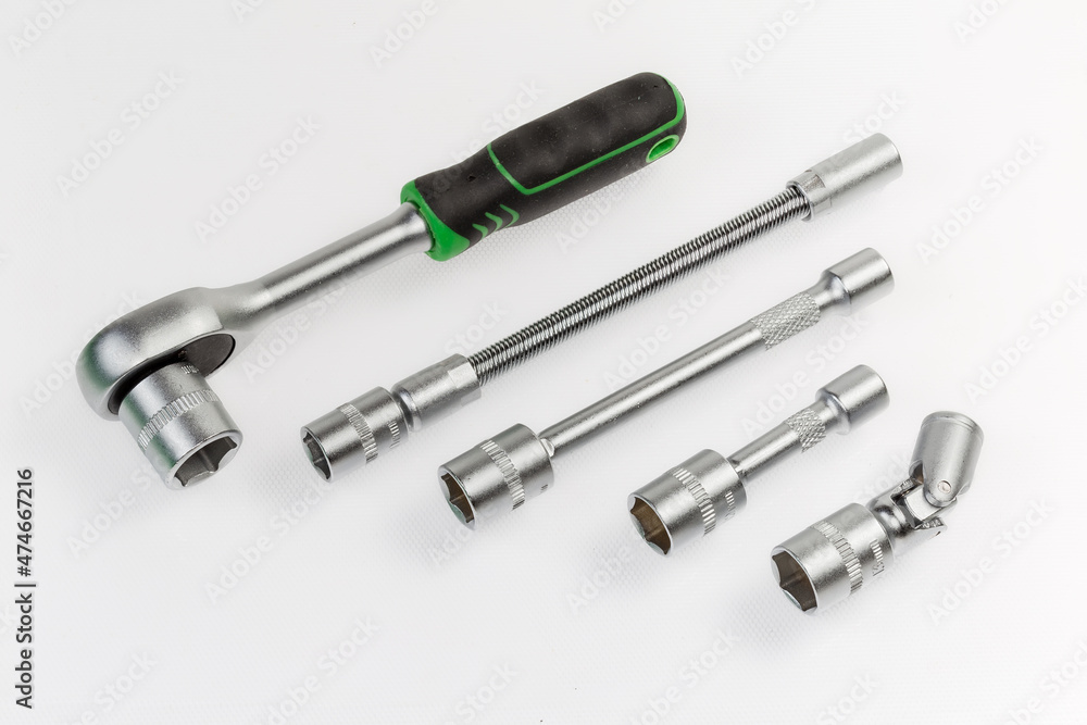 Ratchet wrench and different adapters with inserted interchangeable hexagonal sockets Ratchet wrench and different adapters with inserted interchangeable hexagonal sockets