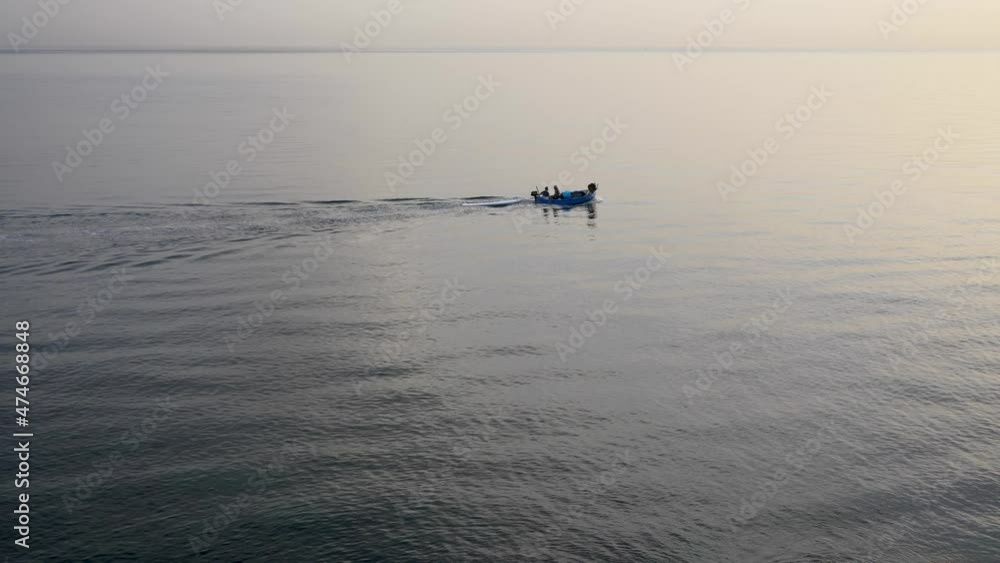 Medium shot fishing trawler in the sea on a summer morning. Slow motion 4K Medium shot fishing trawler in the sea on a summer morning. Slow motion 4K