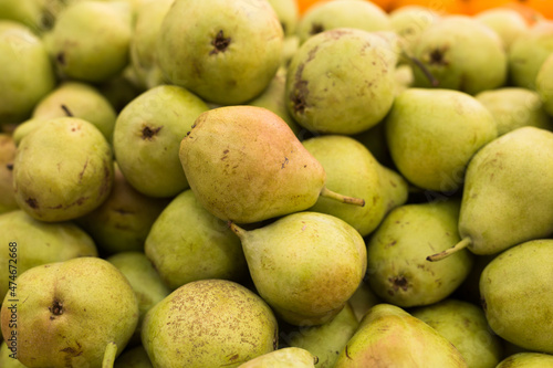 appetizing pears on counter in market