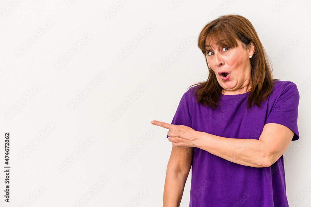 Middle age caucasian woman isolated on white background smiling and pointing aside, showing something at blank space. Middle age caucasian woman isolated on white background smiling and pointing aside, showing something at blank space.