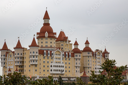 Adler, Russia - April 11, 2021-Hotel in the style of the medieval castle Bogatyr in Sochi Park A majestic building with towers, a palace