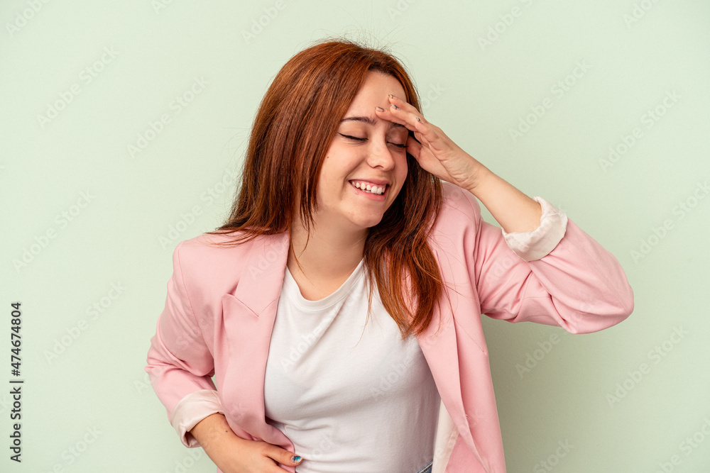 Young caucasian woman isolated on green background joyful laughing a lot. Happiness concept. Young caucasian woman isolated on green background joyful laughing a lot. Happiness concept.