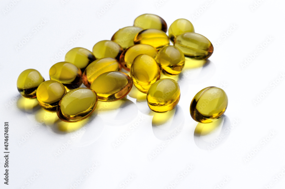 Omega 3 Fish Oil Supplement Capsules on a White Background. Omega 3 Fish Oil Supplement Capsules on a White Background.