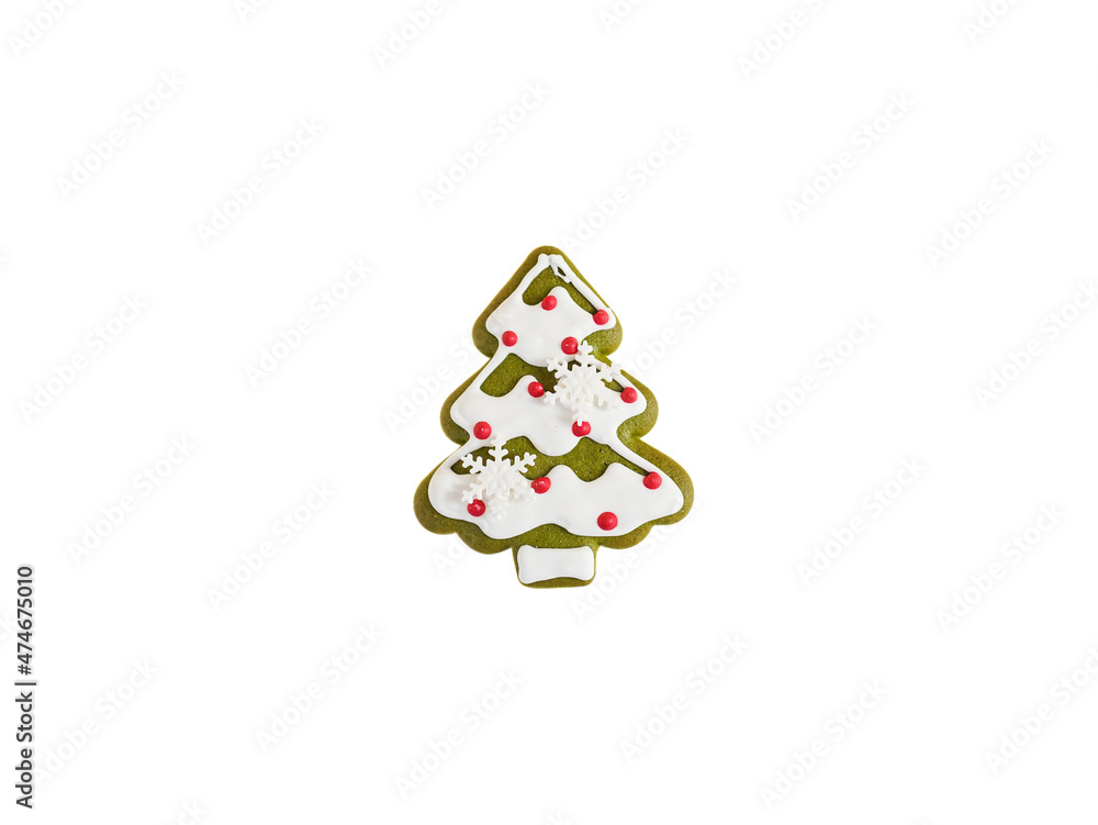 Christmas cookie. A Christmas tree made from matcha green tea gingerbread cookie with sugar glazed icing on top is isolated on a white background. Christmas cookie. A Christmas tree made from matcha green tea gingerbread cookie with sugar glazed icing on top is isolated on a white background.