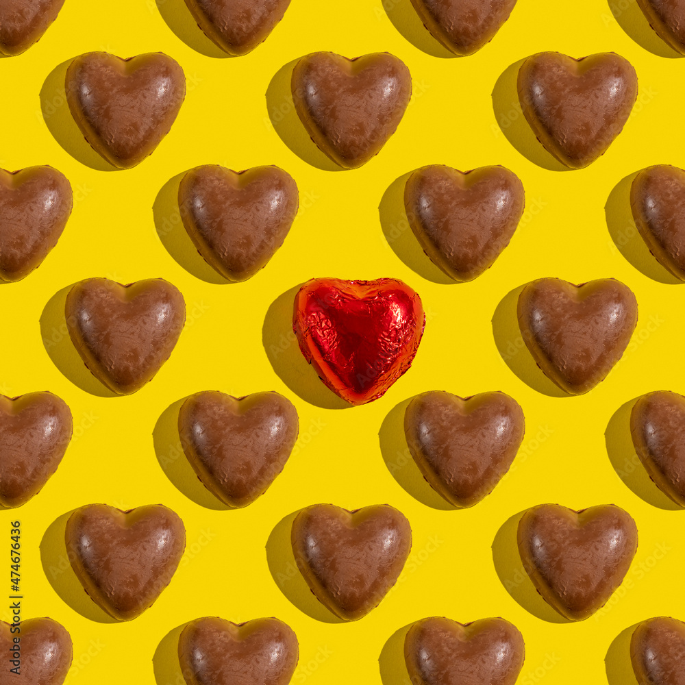 Seamless pattern with chocolate hearts on yellow background. Seamless pattern with chocolate hearts on yellow background.