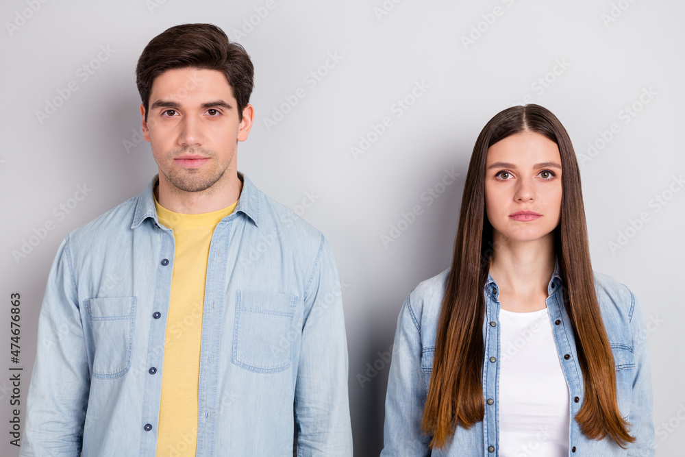 Photo of serious confident guy lady brother sister dressed denim shirts isolated grey color background