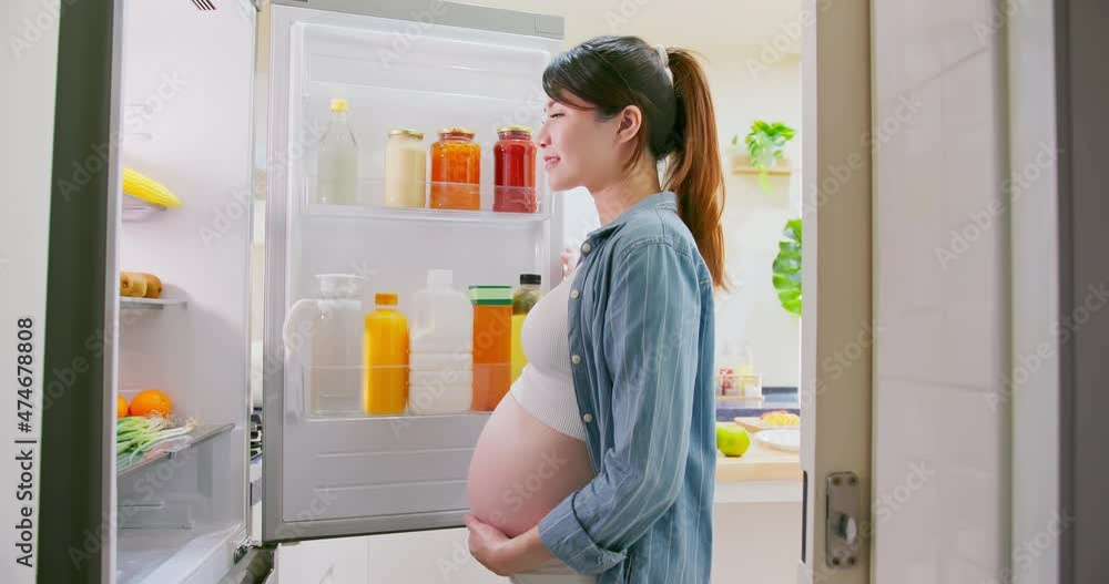 Asian pregnant woman prepare fruit Asian pregnant woman prepare fruit