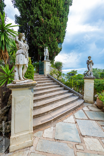 Achilleion palace, Corfu, Greece - October 24, 2021: Classical statues at the Achillion Palace on the island of Corfu. photo