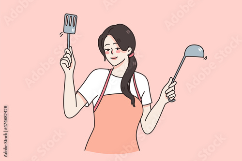 Happy young woman in apron hold domestic utensils cooking dinner or lunch at home. Smiling female cook or chef prepare tasty food or meal. Cuisine, housewife job concept. Vector illustration. 