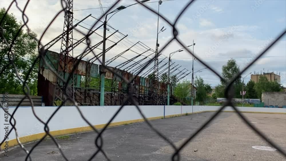 An abandoned, rusty stadium. Abandoned hockey rink. An abandoned, rusty stadium. Abandoned hockey rink.