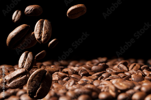 Beautiful background with coffee beans in dark colors