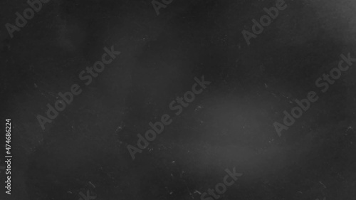 Black and white wall grunge stone backdrop background. Black abstract texture close-up. Dark old paper background. Grunge concrete wall. Vintage blank wallpaper.