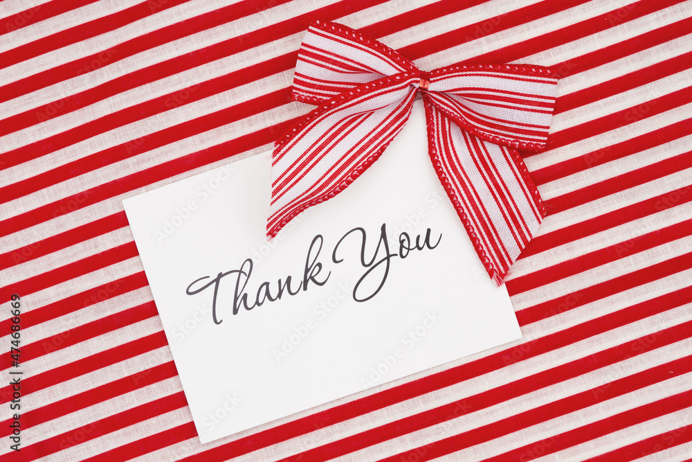 Fototapeta premium Thank you greeting card with red and white candy cane bows