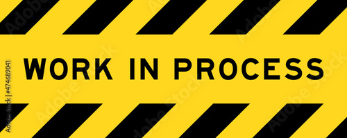 Yellow and black color with line striped label banner with word work in process