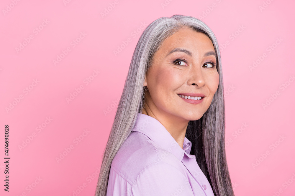 Profile side view portrait of attractive minded cheery gray-haired woman thinking copy space isolated over pink pastel color background