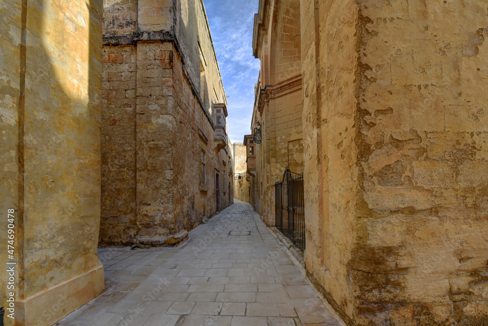 narrow stone street in old port city