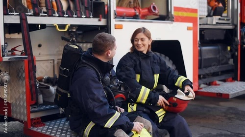 A team of firemen at the form of a fire machine photo