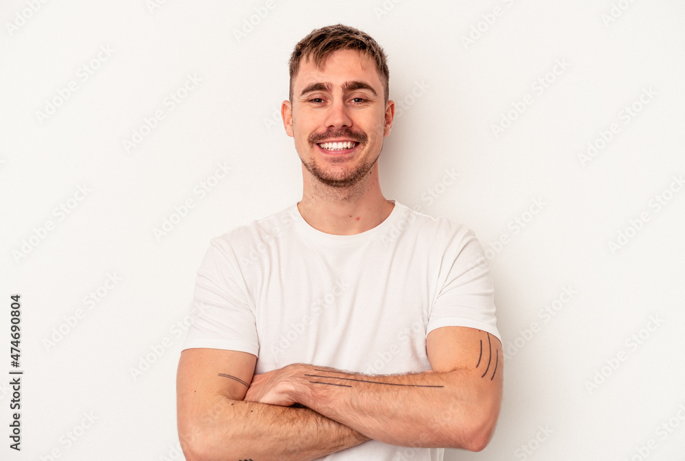 Young caucasian man isolated on white background trying to listening a gossip. Young caucasian man isolated on white background trying to listening a gossip.